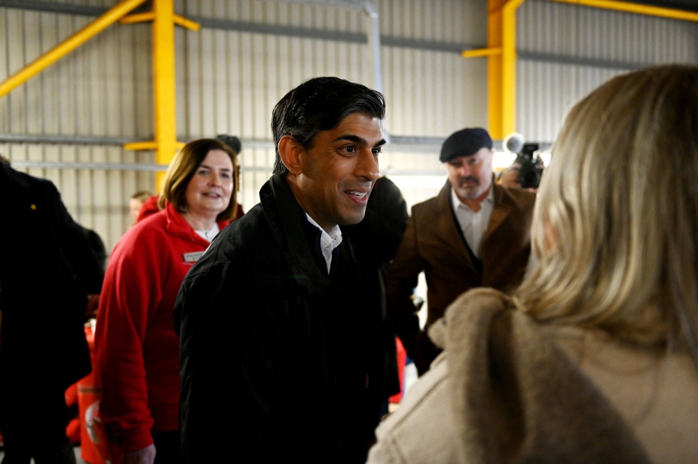 Prime Minister Rishi Sunak visits Air Ambulance Northern Ireland at their headquarters in Lisburn, Northern Ireland, February 4, 2024. — Reuters pic
