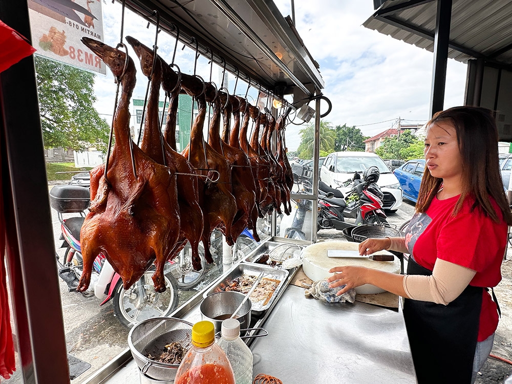 Golden brown roast duck in a row draws everyone's attention.