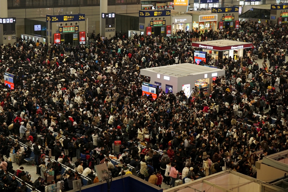 Travellers wait for their trains at Shanghai Hongqiao railway station, during the Spring Festival travel rush ahead of the Chinese Lunar New Year, in Shanghai, China February 5, 2024. — Reuters pic