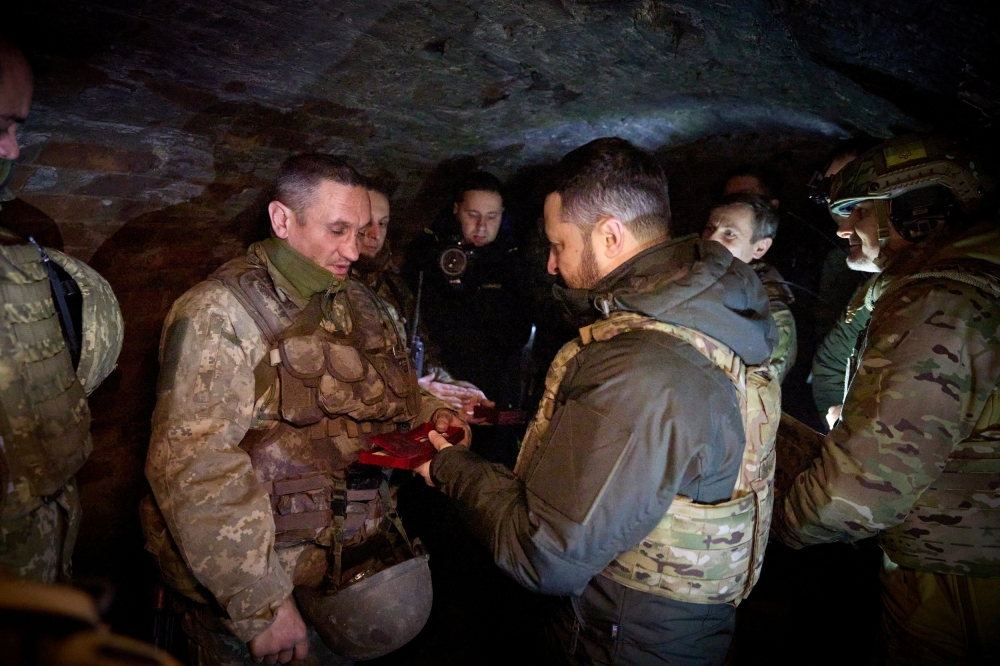 Ukraine's President Volodymyr Zelenskiy awards a Ukrainian service member during his visit at a frontline, amid Russia's attack on Ukraine, in the Zaporizhzhia region, Ukraine February 4, 2024. — Ukrainian Presidential Press Service handout via Reuters pic
