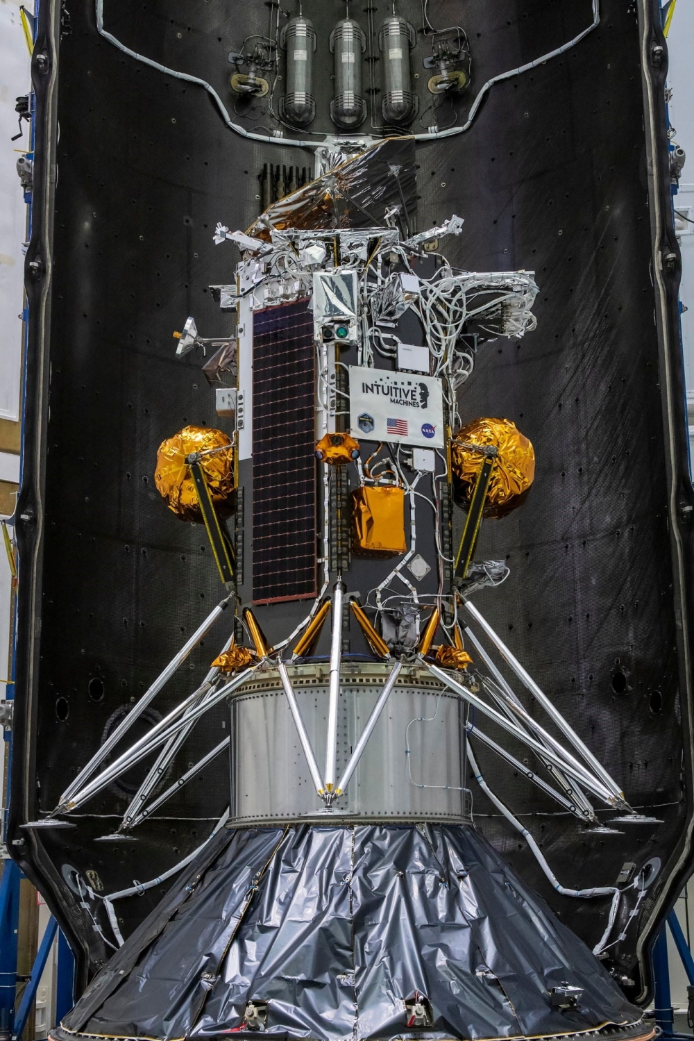 This handout picture obtained by Nasa on February 7, 2024 shows the Nova-C lunar lander encapsulated within the fairing of a SpaceX Falcon 9 rocket in preparation for launch, as part of Nasa's CLPS (Commercial Lunar Payload Services) initiative and Artemis campaign in Kennedy Space Center, Florida. — Handout / Nasa / AFP pic