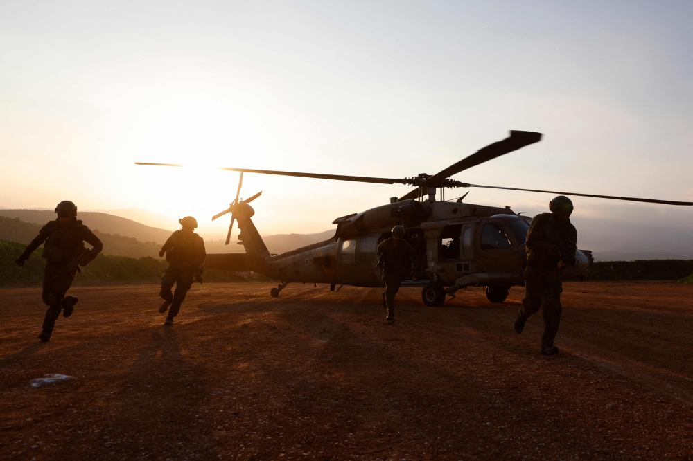 Israeli soldiers take part in a military exercise in Upper Galilee near the Lebanon border on February 7, 2024, amid ongoing battles between Israel and Palestinian Hamas militants in the Gaza Strip. — AFP pic