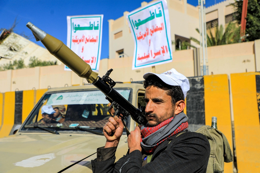 An armed supporter of Yemen's Houthi movement stands carrying a rocket-propelled grenade (RPG) launcher during a pro-Palestinian rally in the Houthi-held capital Sanaa on February 7, 2024 amid the ongoing conflict in the Gaza Strip between Israel and the Palestinian militant group Hamas. — AFP pic