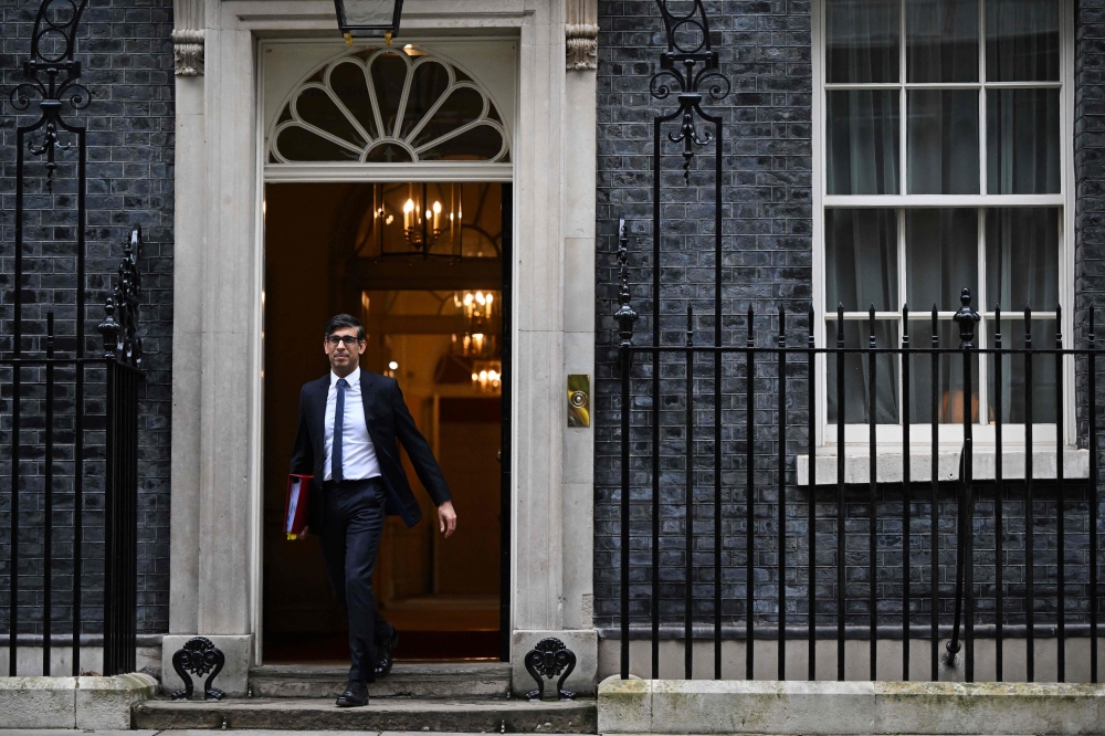 Britain's Prime Minister Rishi Sunak leaves from 10 Downing Street in central London on February 7, 2024 to take part in the weekly session of Prime Minister's Questions (PMQs) in the House of Commons. — AFP pic