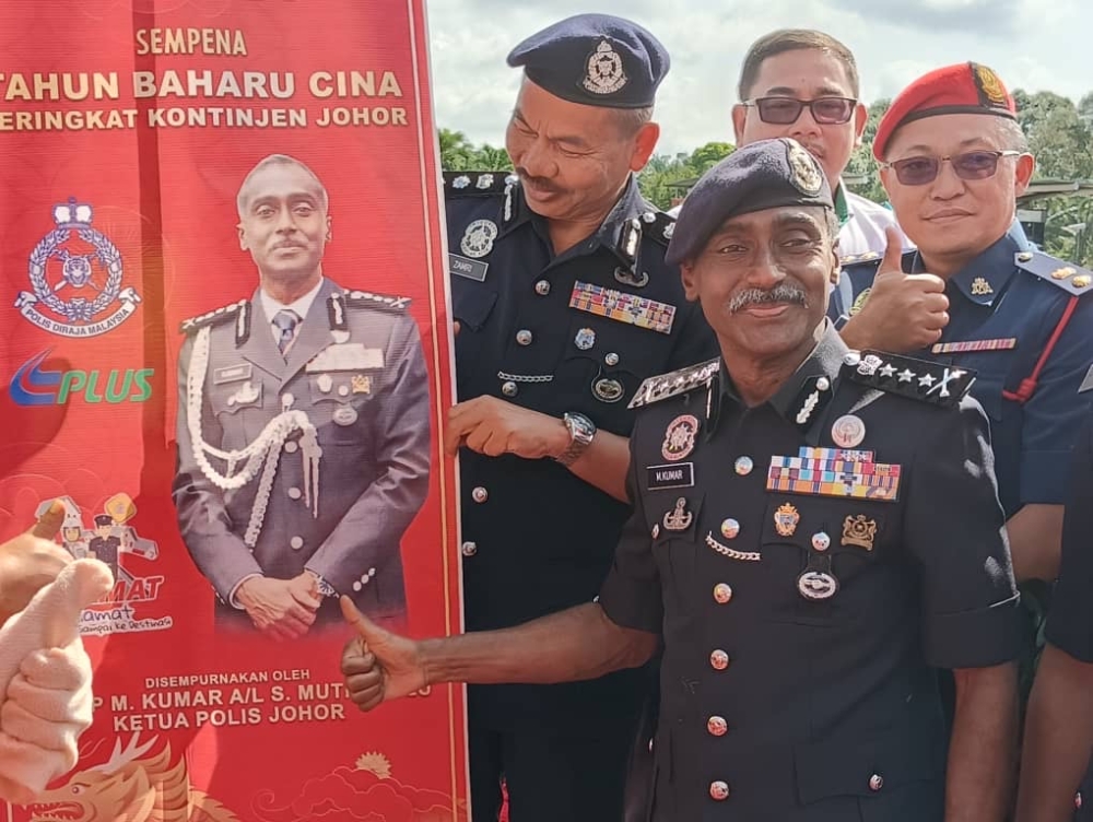 Johor police chief M. Kumar (front) after officiating the Op Selamat operation in conjunction with the Chinese New Year at the Kempas toll plaza in Johor Baru February 8, 2024. ― Picture by Ben Tan