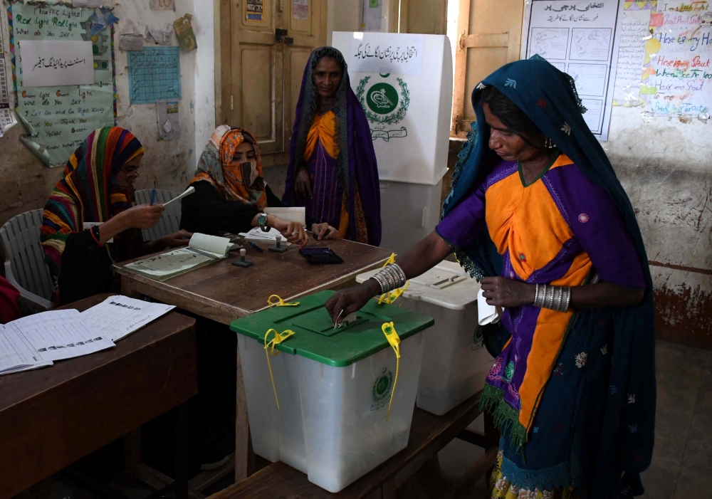 A Hindu woman casts her vote at a polling station during a general election, in Tando Allahyar, Sindh, Pakistan February 8, 2024. — Reuters pic  