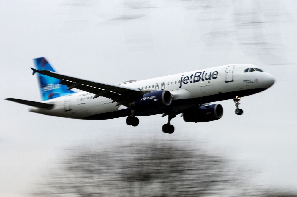 A JetBlue Airways jet comes in for a landing after flights earlier were grounded during an FAA system outage at Laguardia Airport in New York City, New York January 11, 2023. 