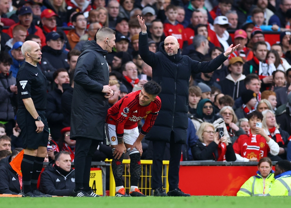 Erik ten Hag has defended his decision to let Manchester United defender Lisandro Martinez play on after the Argentine suffered a knee injury that will rule him out for two months. — Reuters pic