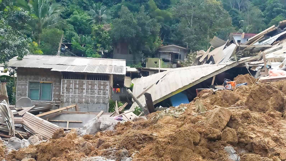 A child was rescued today nearly 60 hours after a rain-induced landslide hit a gold-mining village in the southern Philippines, killing at least 11 people and leaving more than a hundred missing. — AFP pic/Office of the Provincial Fire Marshal (OPFM) Davao de Oro