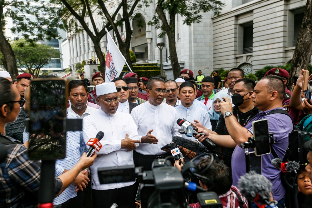 After the Federal Court struck down 16 out of 18 provisions under the Kelantan Shariah criminal enactment as unconstitutional, PAS secretary-general Datuk Seri Takiyuddin Hassan described today as “Black Friday” as the decision, he claimed, has questioned the integrity of the Sultan of Kelantan. — Picture by Hari Anggara.