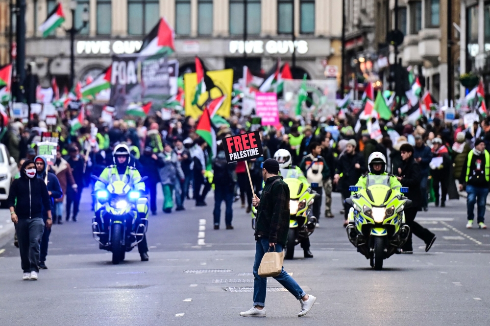 Demonstrators who climb national monuments could face a three-month jail sentence or a £1,000 fine under the new proposals. — AFP pic