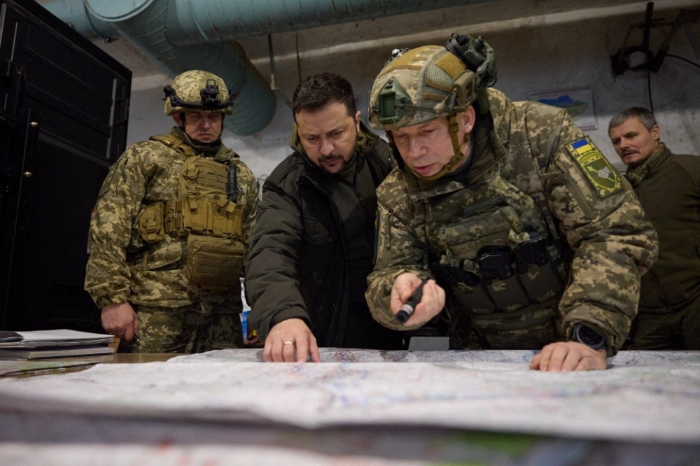 This handout photograph taken and released by the Ukrainian Presidential Press Service on November 30, 2023 shows Ukrainian President Volodymyr Zelensky and Colonel General Oleksandr Syrskyi (right) at an army command post in Kupiansk, Kharkiv region. — AFP pic