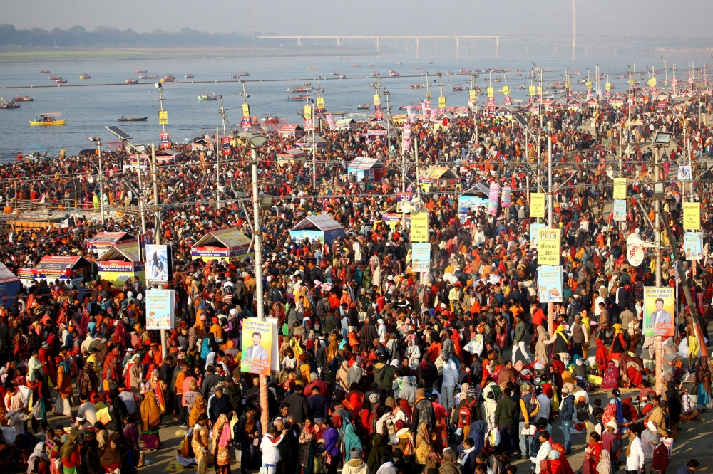 Hindu devotees gather on the banks of the Sangam, the confluence of the Ganges, Yamuna and Saraswati rivers, to take a holy dip to mark Mauni Amavasya, the most auspicious day, during the Magh Mela festival in Prayagraj, India, February 9, 2024. — Reuters pic