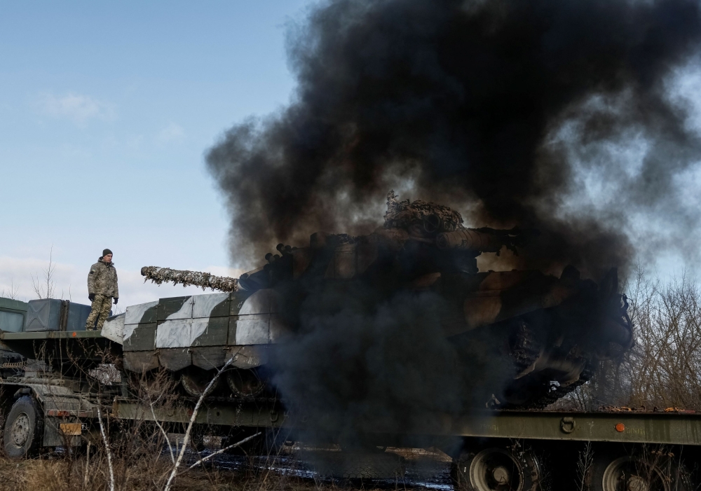 A Ukrainian tank starts engine while being unloaded for repairs, amid Russia's attack on Ukraine, in northern Ukraine February 8, 2024. — Reuters pic