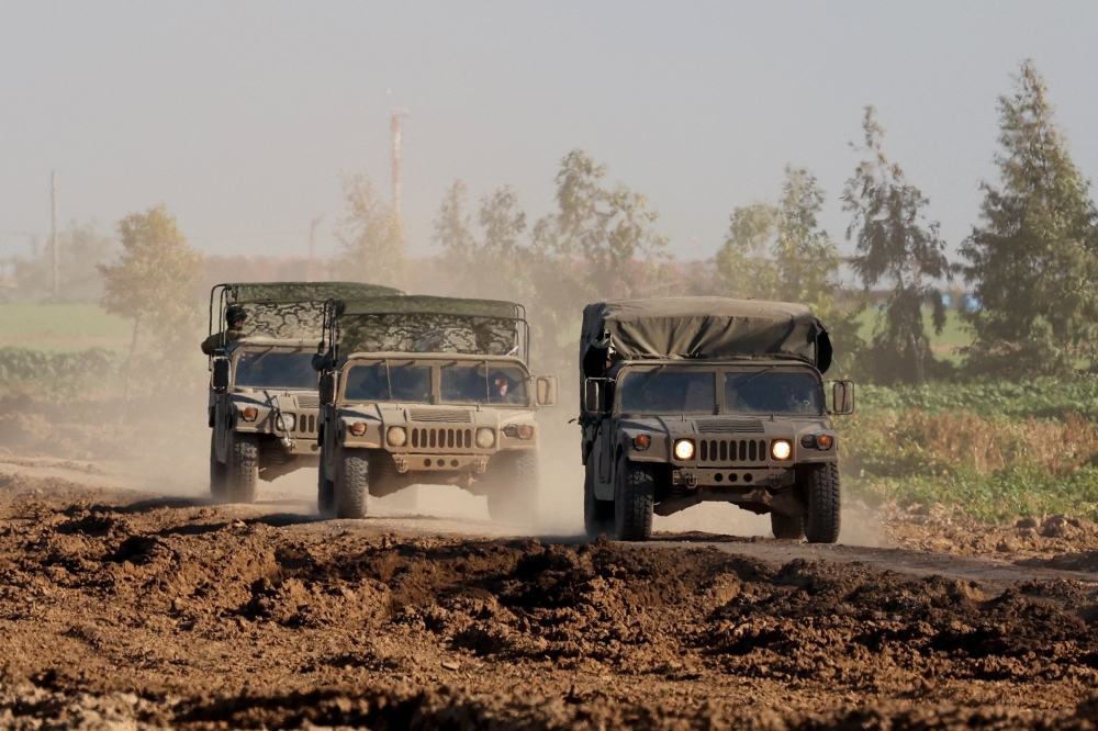A picture taken from a position in southern Israel along the border with the Gaza Strip on February 9, 2024, shows Israeli military vehicles amid continuing battles between Israel and the Palestinian fighter group Hamas. — AFP pic