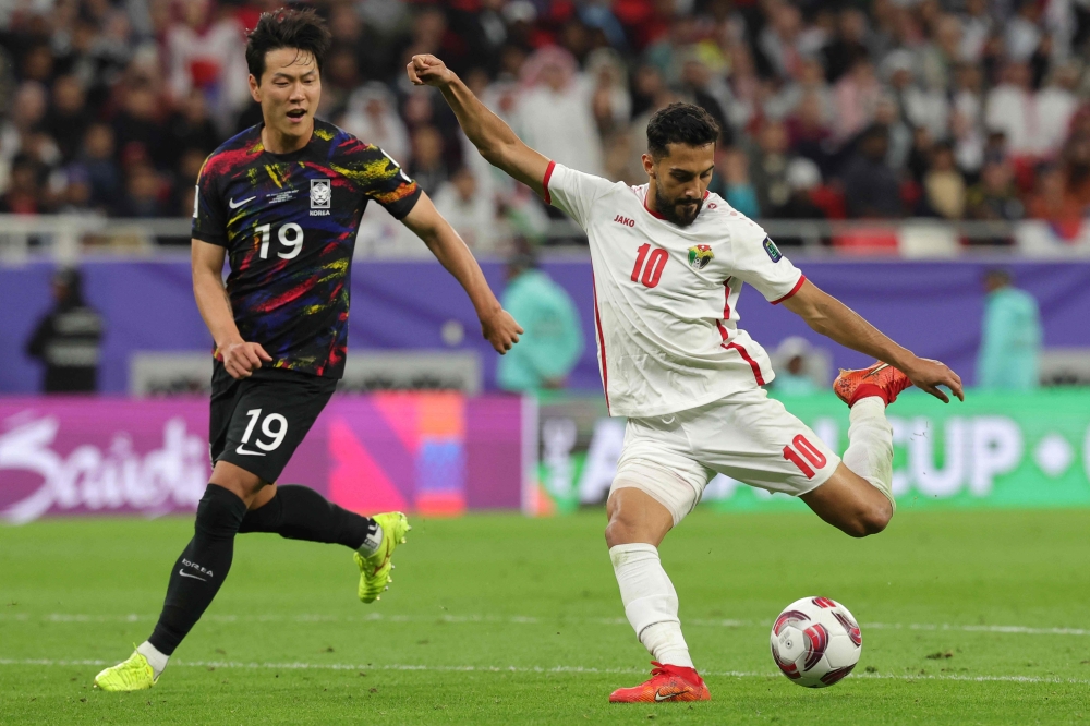 Jordan’s midfielder Musa al-Tamari kicks the ball past South Korea’s defender Kim Young-gwon during the Qatar 2023 AFC Asian Cup semi-final football match between Jordan and South Korea at the Ahmad Bin Ali Stadium in Al-Rayyan, west of Doha on February 6, 2024. — AFP pic 