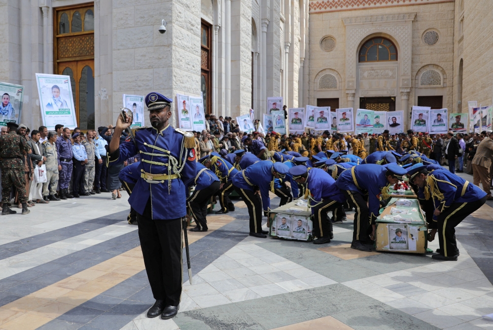 Honour guards carry the coffins of Houthi fighters killed in US-led strikes, during their funeral in Sanaa, Yemen February 10, 2024. — Reuters pic