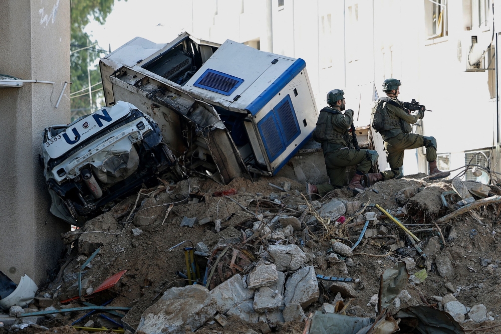 This picture taken during a media tour organised by the Israeli army on February 8, 2024, shows Israeli soldiers inside a compound of the United Nations Relief and Works Agency for Palestine Refugees (UNRWA) in the Gaza Strip. — AFP pic