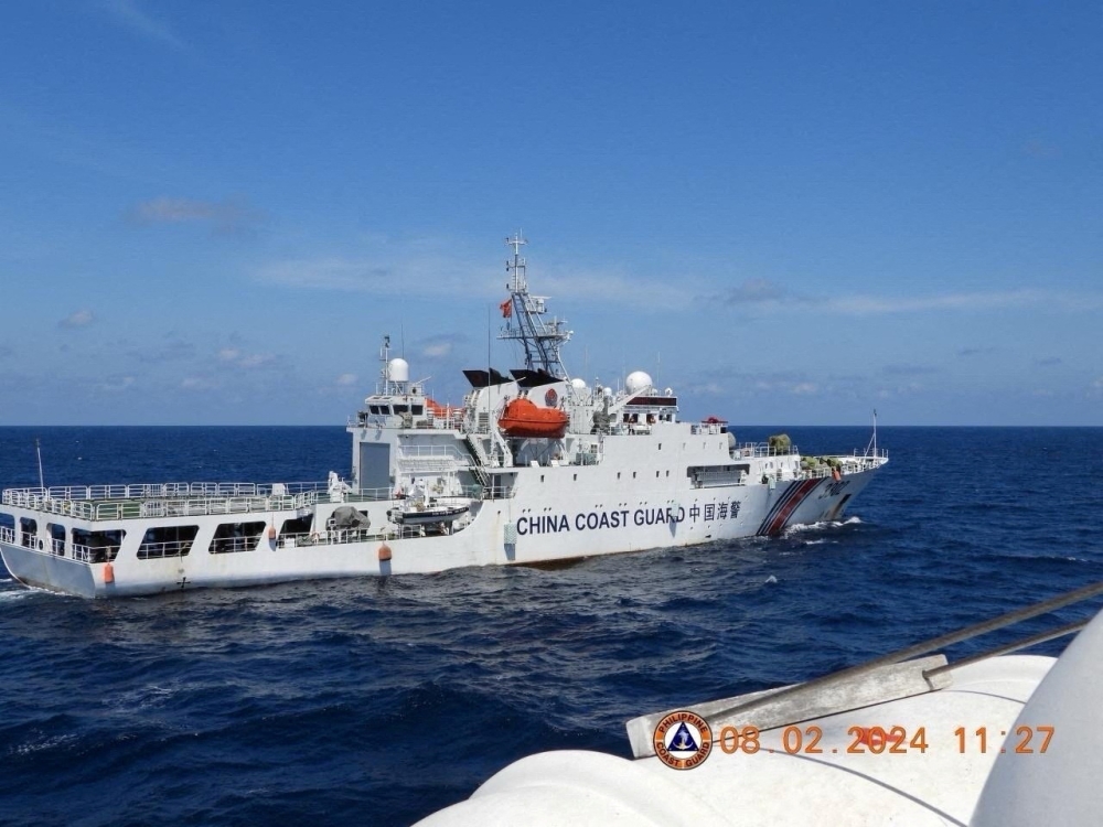 A China Coast Guard vessel manoeuvres near Philippine Coast Guard vessel BRP Teresa Magbanua near Scarborough Shoal in the South China Sea, Philippines, February 8, 2024. — Philippine Coast Guard handout via Reuters