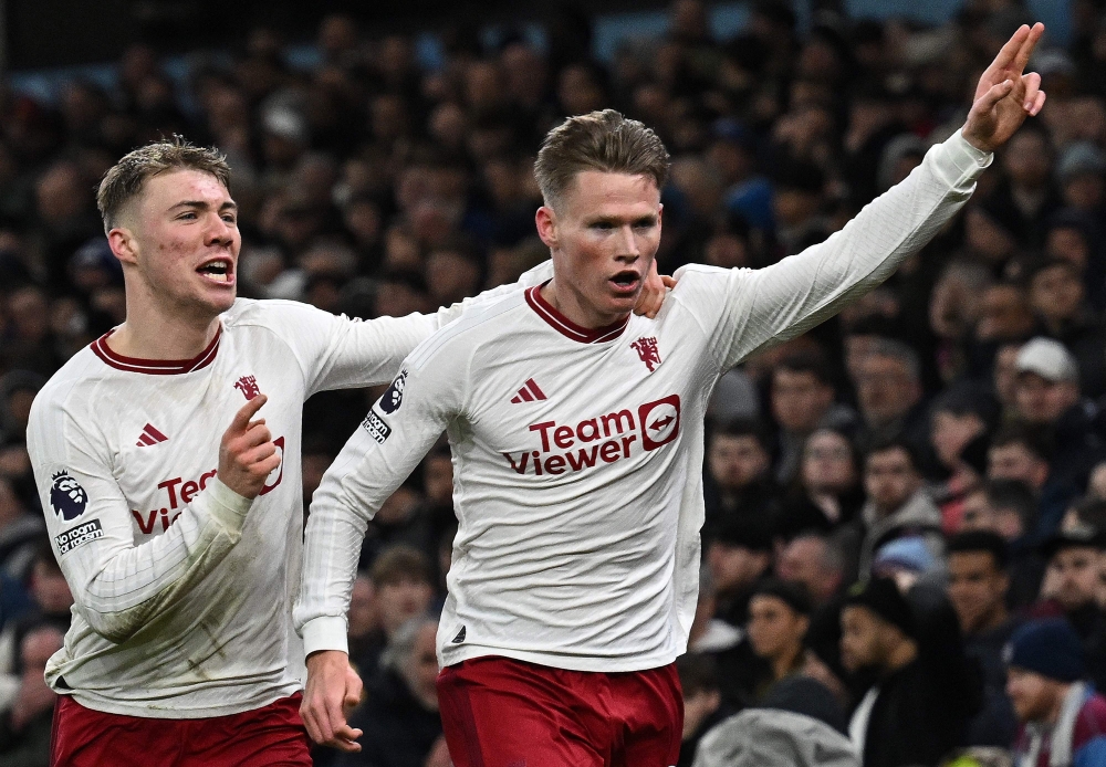 Manchester United's Scottish midfielder #39 Scott McTominay celebrates scoring the team's second goal with Manchester United's Danish striker #11 Rasmus Hojlund during the English Premier League football match between Aston Villa and Manchester United at Villa Park in Birmingham, central England on February 11, 2024. — AFP pic