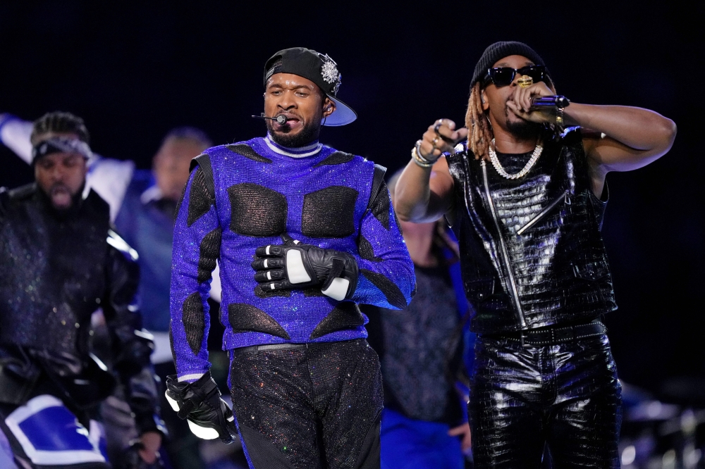 Usher delivered a high-energy Super Bowl halftime show yesterday that featured surprise appearances by some of his most famous collaborators as the R&B star rolled through a parade of his hits. — Picture by Kirby Lee-USA TODAY Sports via Reuters