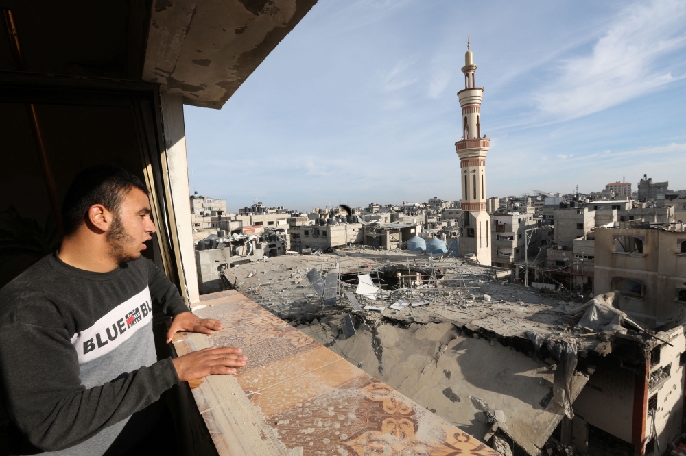 A Palestinian man looks at the site of an Israeli strike on a mosque, amid the ongoing conflict between Israel and the Palestinian Islamist group Hamas, in Rafah in the southern Gaza Strip, February 12, 2024. — Reuters pic