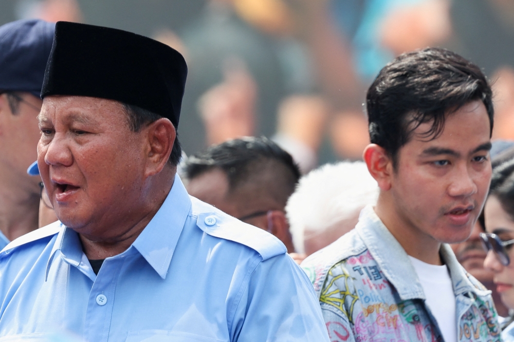 Indonesia's Defence Minister and presidential candidate Prabowo Subianto and his running mate Gibran Rakabuming Raka, who is the eldest son of Indonesian President Joko Widodo, attend their campaign rally in Jakarta, Indonesia February 10, 2024. — Reuters pic