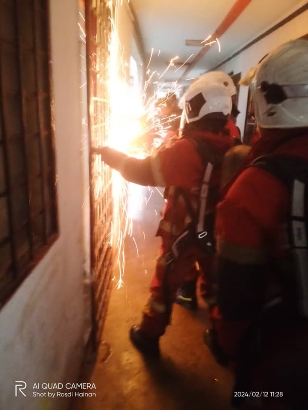 Selangor Fire and Rescue Department personnel are seen during the rescue of six siblings who were left in a locked house because their parents went to the hospital. — Picture courtesy of Selangor Fire and Rescue Dept