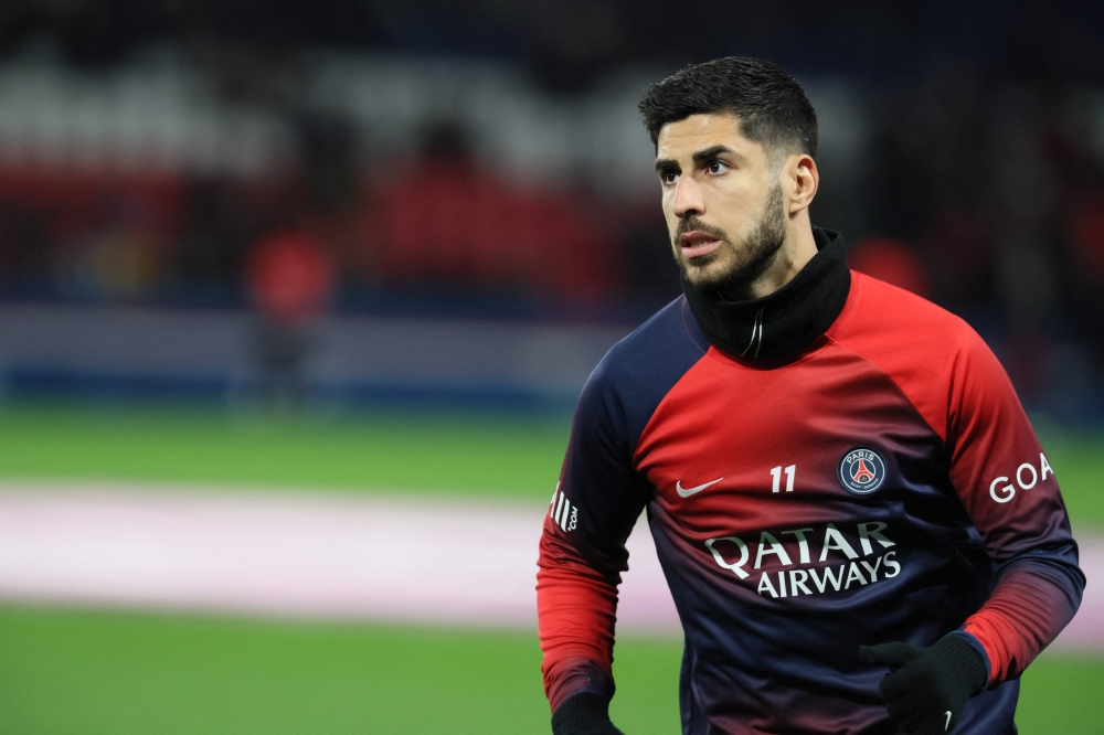 Paris Saint-Germain's Spanish forward #11 Marco Asensio warms up ahead of the French L1 football match between Paris Saint-Germain (PSG) and Lille LOSC at the Parc des Princes stadium in Paris February 10, 2024. — AFP pic 