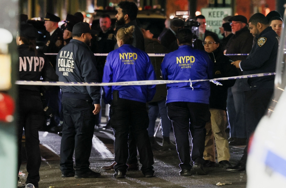 Members of the New York Police Department (NYPD) investigate the scene of a shooting at the Mount Eden Avenue subway station in the Bronx borough of New York City February 12, 2024. — Reuters pic