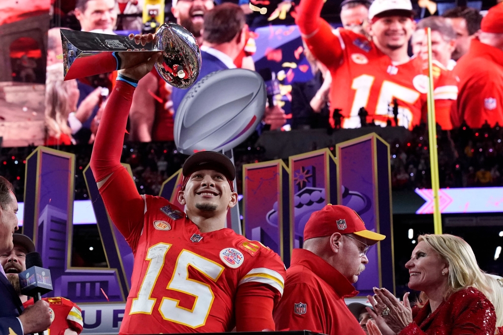 Kansas City Chiefs' quarterback #15 Patrick Mahomes celebrates with the trophy after the Chiefs won Super Bowl LVIII against the San Francisco 49ers at Allegiant Stadium in Las Vegas, Nevada February 11, 2024. — AFP pic 