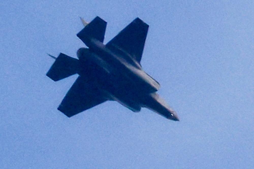 An Israeli air force fighter aircraft flies over the border area with south Lebanon in northern Israel on February 13, 2024 amid ongoing cross-border tensions as fighting continues between Israel and Palestinian Hamas militants in the Gaza Strip. — AFP pic