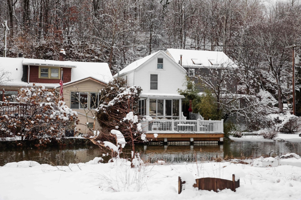 Houses are seen following a snowstorm in Piermont New York, on February 13, 2024. — AFP pic