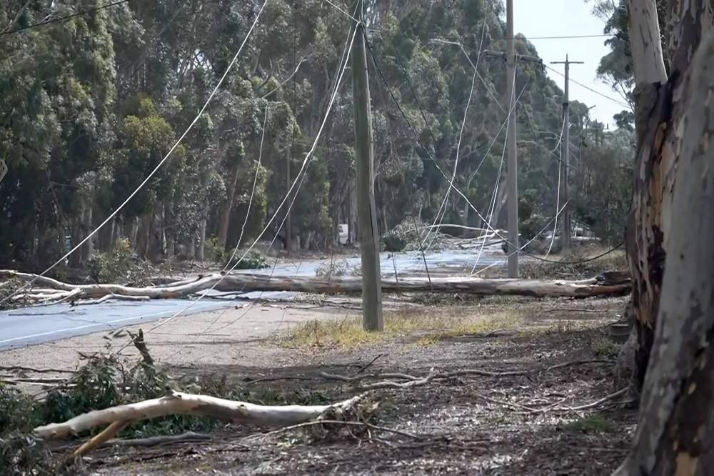 This frame grab from video footage taken on February 13, 2024 and provided by Australian Broadcast Corporation (ABC) on February 14 via AFPTV shows downed powerlines near Lara after a storm. — ABC / AFP pic