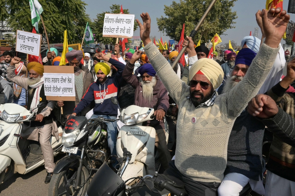 Farmers shout slogans during a protest demanding minimum crop prices in Amritsar on February 13, 2024. — AFP pic