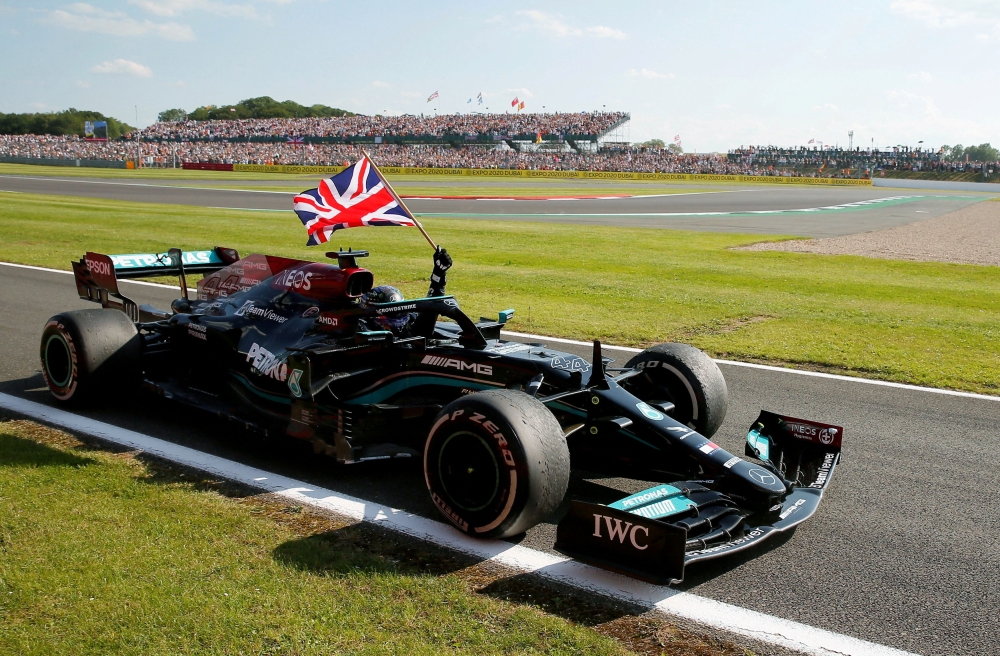 Mercedes' Lewis Hamilton celebrates after winning the British Grand Prix Formula One race at the Silverstone Circuit, Silverstone July 18, 2021. — Reuters pic  