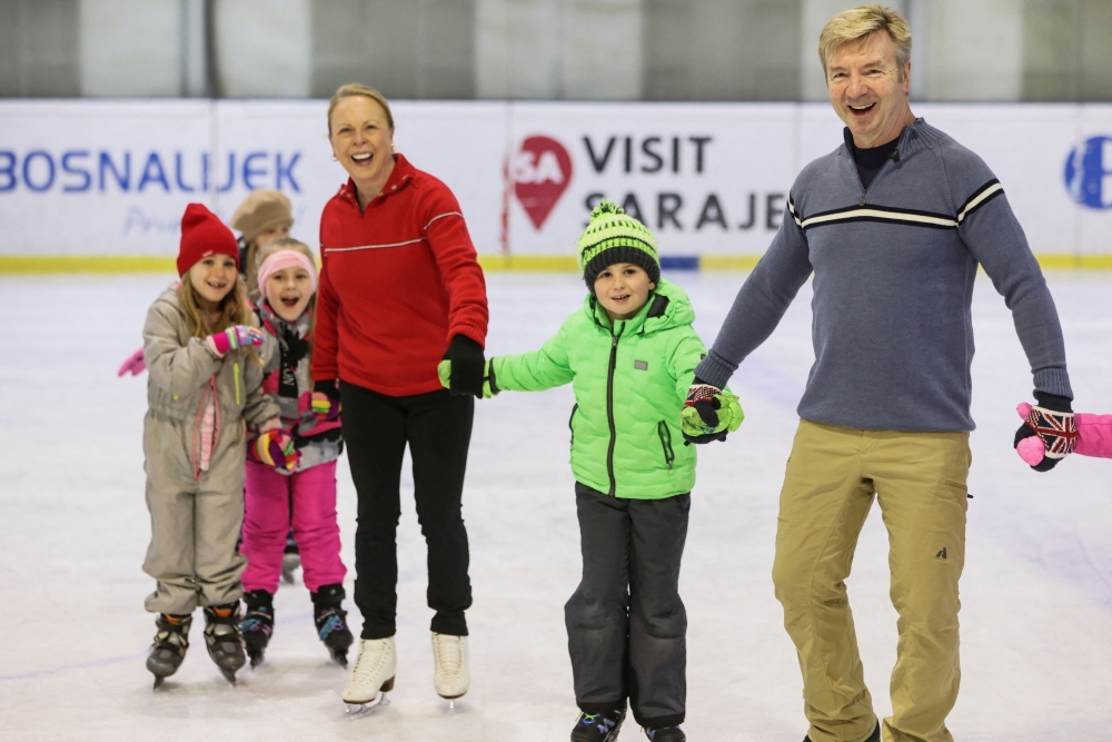 British ice dancers Jayne Torvill and Christopher Dean react during a practice with Bosnian children, for a performance marking the 40th anniversary of the Sarajevo Winter Olympic Games and their gold medal-winning performance Bolero in the 1984 Winter Olympics, in Sarajevo, Bosnia and Herzegovina, February 13, 2024. — Reuters pic  