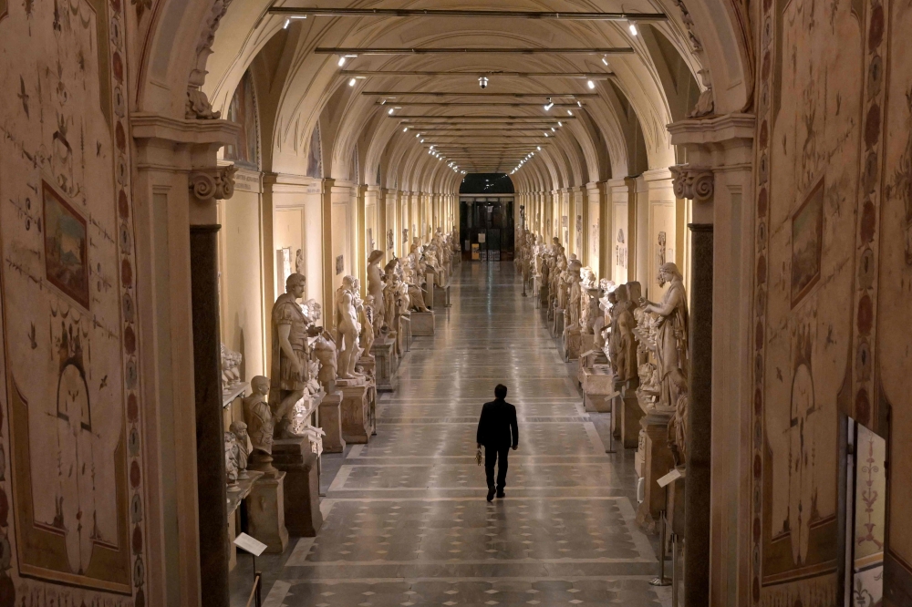Gianni Crea, key keeper of the Vatican Museums, holds a big mast of keys as he walks in a gallery during a private visit of the museums by night, on February 13, 2024. — AFP pic