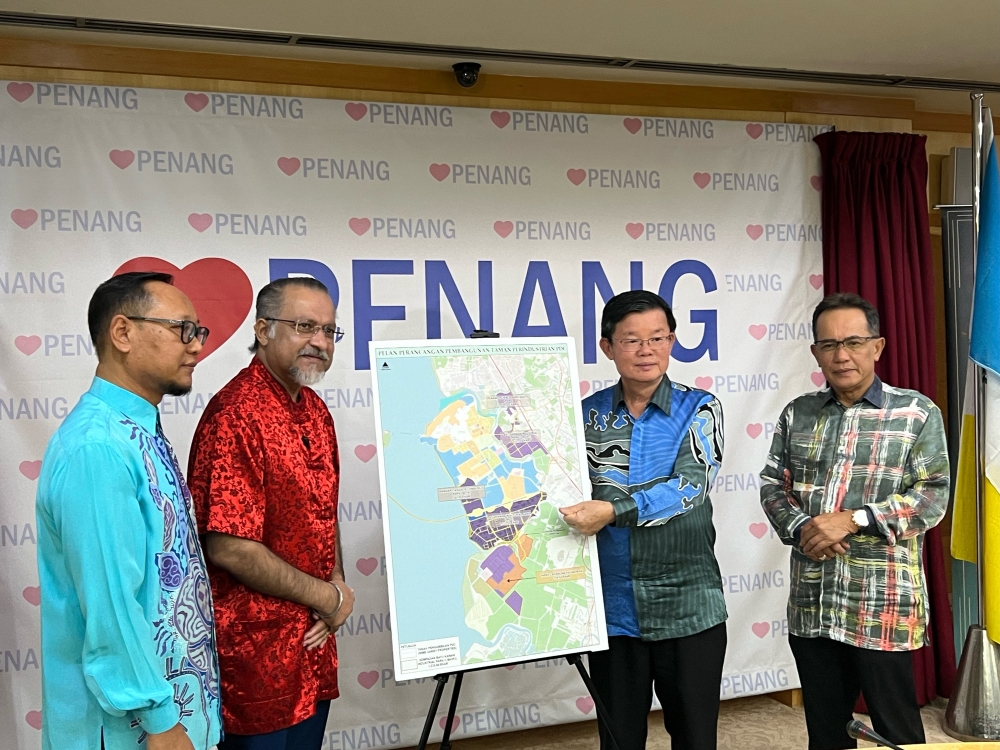 Penang Chief Minister Chow Kon Yeow (second, right) shows the BKIP2 land which is now open for tender. — Picture by Opalyn Mok