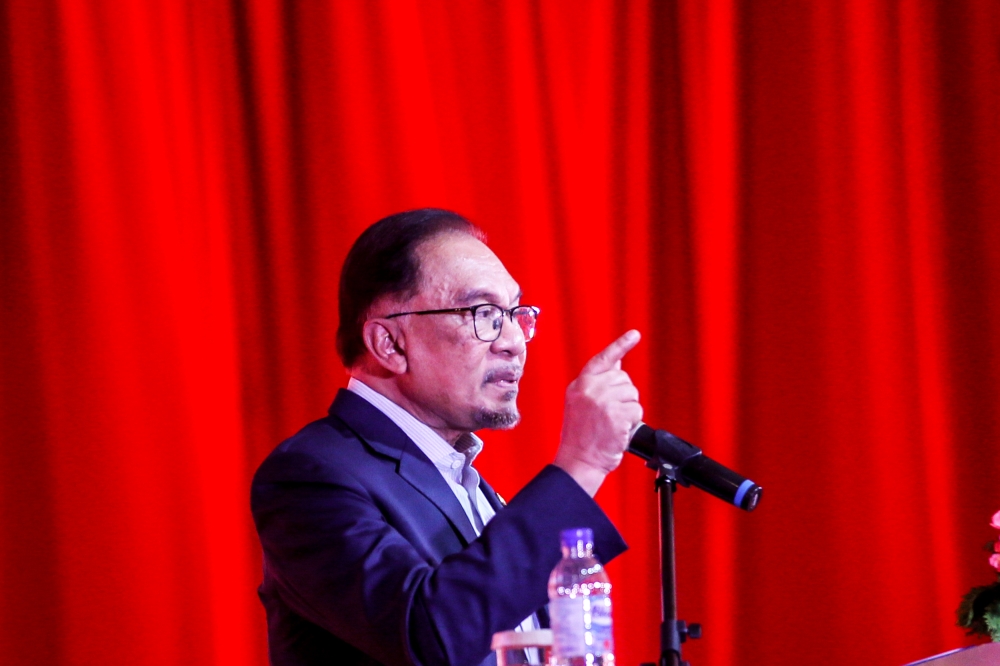 Prime Minister Datuk Seri Anwar Ibrahim delivers his speech at the 2024 Chinese New Year celebration of the Associated Chinese Chambers of Commerce and Industry of Malaysia (ACCCIM) in Shangri-La Hotel February 15, 2024. — Picture by Hari Anggara
