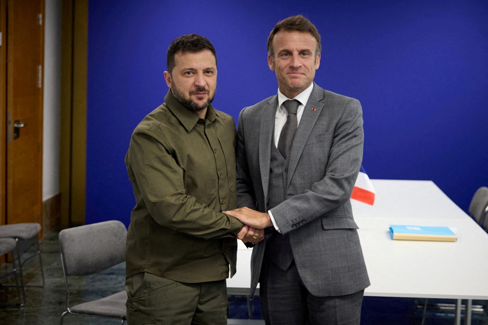 Ukraine's President Volodymyr Zelenskiy and French President Emmanuel Macron pose for a picture during a meeting on the sidelines of the European Political Community Summit in Granada, Spain October 5, 2023. — Ukrainian Presidential Press Service handout via Reuters pic