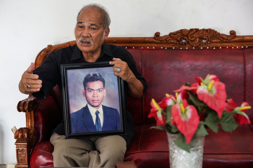 Paian Siahaan, the 77-year-old father of Ucok Munandar Siahaan who went missing during the May 1998 riots and was allegedly kidnapped by a team under the command of former special forces general and the country’s presumed new president, Prabowo Subianto, gestures during an interview at his house in Depok on the outskirts of Jakarta, Indonesia, February 15, 2024. — Reuters pic