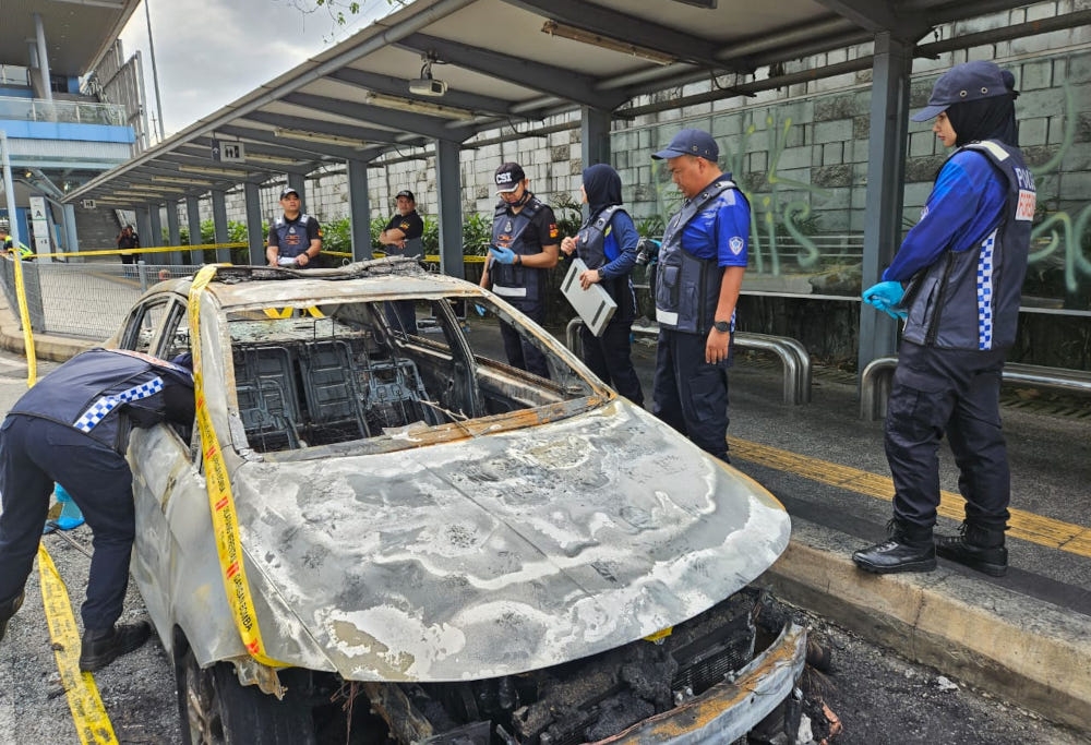 In the incident at 1.42am today, a car belonging to Prasarana Malaysia Berhad’s auxiliary police was torched, believed to be caused by a Molotov cocktail that was thrown at it, near the Mutiara Damansara mass rapid transit (MRT) station, February 15, 2024. — Picture from X/Bernama 