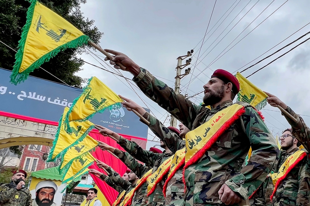 Fighters of the Lebanese Shiite group Hezbollah parade during a ceremony to commemorate the party's fallen leaders in the Lebanese village of Jibshit, about 50 kilometres south of the capital Beirut on February 15, 2024. — AFP pic