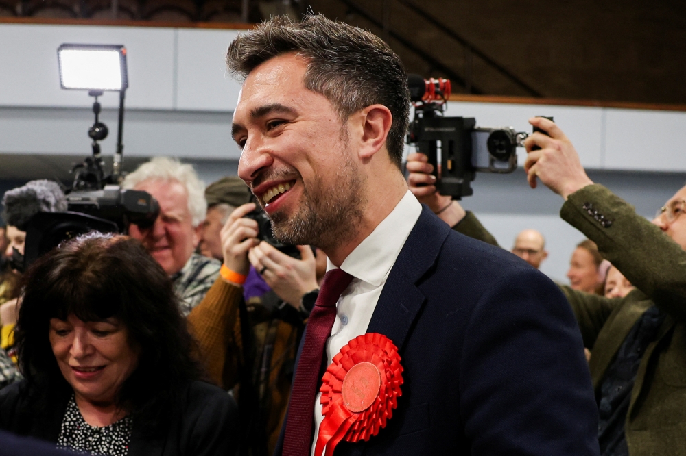 Labour Party candidate Damien Egan reacts after winning the Kingswood Parliamentary by-election at Thornbury Leisure centre in Thornbury, Britain, February 16, 2024. — Reuters pic