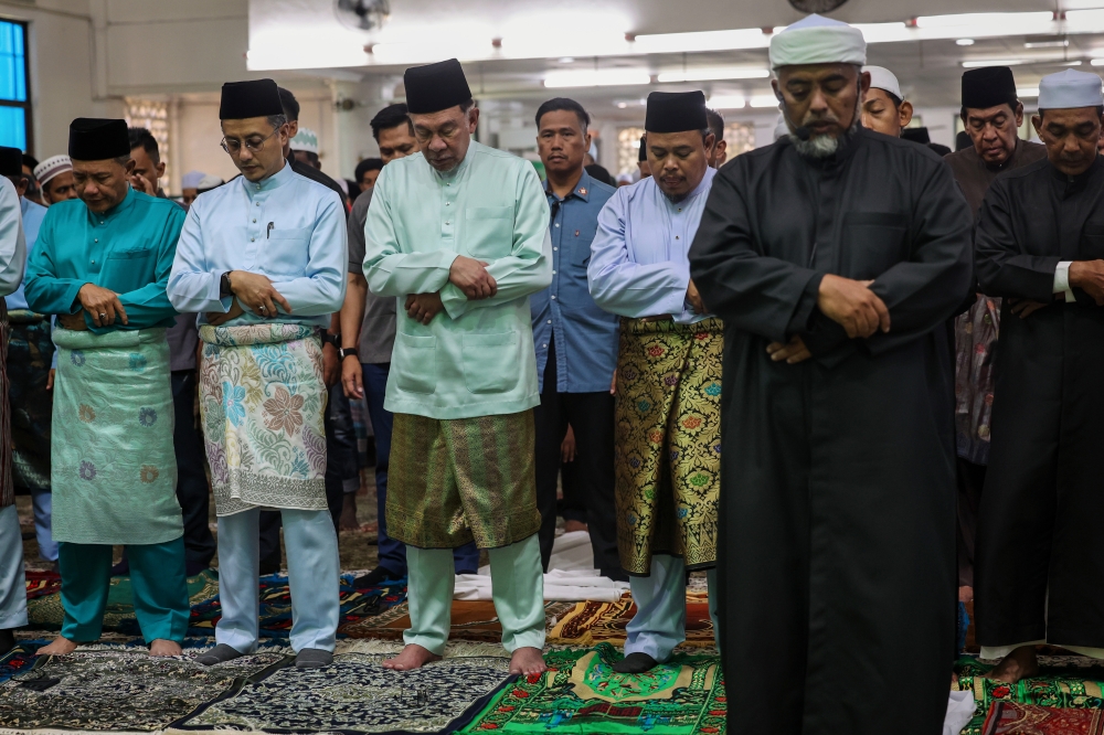 Prime Minister Datuk Seri Anwar Ibrahim performs Friday prayers at Masjid Jamek Tengah Berapit with other congregants, Bukit Mertajam, February 16, 2024. — Bernama pic  