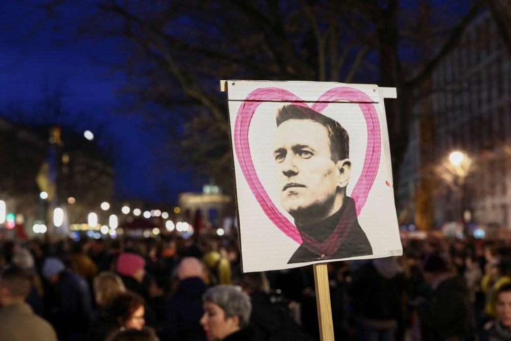 A sign with an image of Russian opposition leader Alexei Navalny is seen as people attend a vigil held in front of the Russian embassy in Berlin, Germany February 16, 2024. ― Reuters pic
