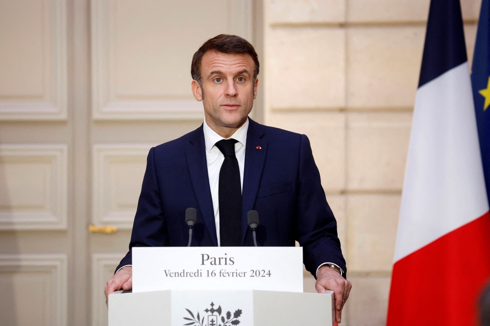 French President Emmanuel Macron speaks while making a joint statement with King of Jordan Abdullah II at the Elysee Palace in Paris, France February ― 2024. ― Yoan Valat/Pool via Reuters