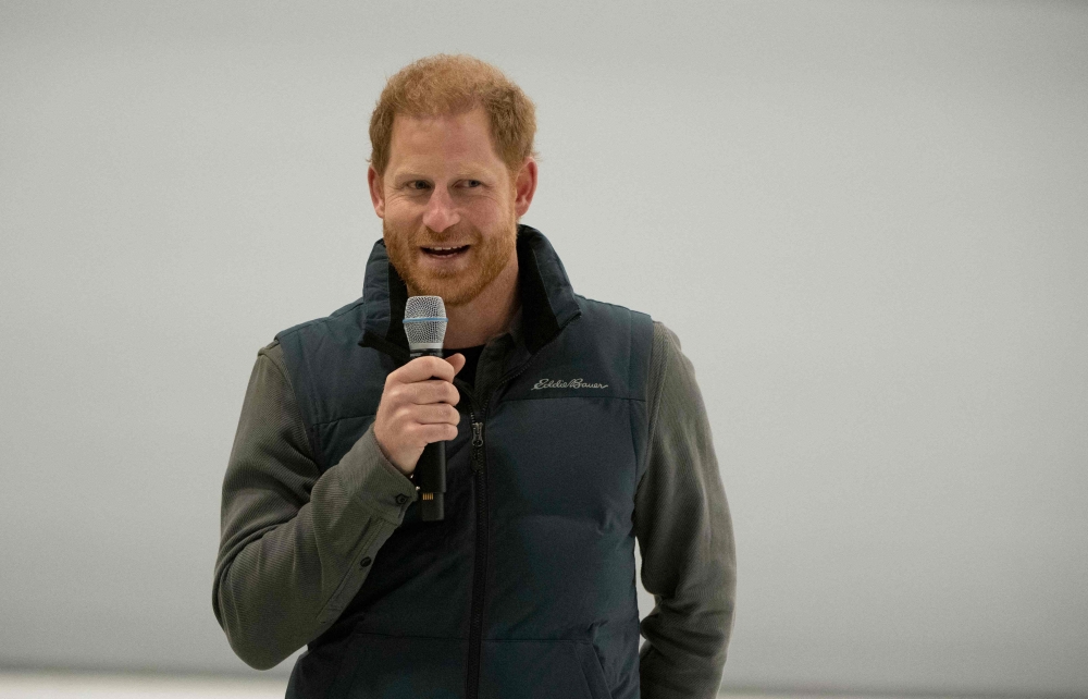 Britain's Prince Harry, Duke of Sussex, speaks during a wheelchair curling demonstration at the ‘Invictus Games Vancouver Whistler 2025's One Year to Go’ winter training camp in Whistler, British Columbia, Canada, February 16, 2024. — AFP pic