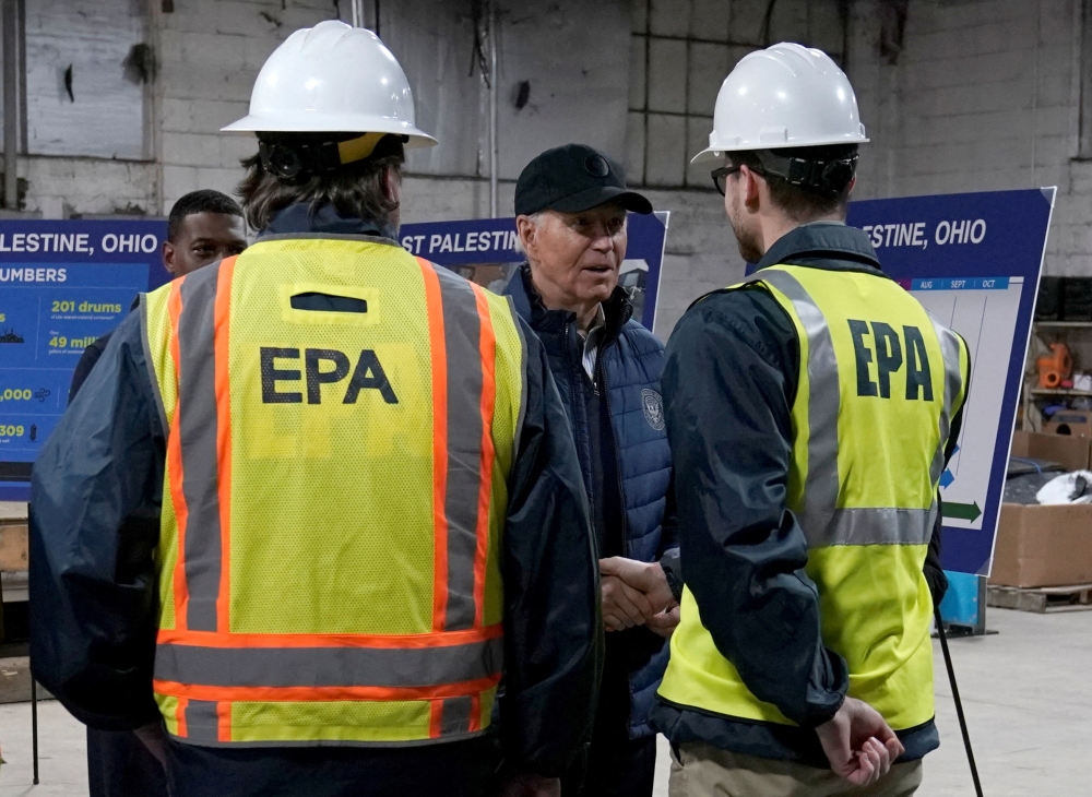 US President Joe Biden speaks with Environmental Protection Agency workers during his visit to East Palestine for the first time since a fiery derailment of a Norfolk Southern train a year ago released more than a million gallons of hazardous materials and pollutants, in East Palestine, Ohio February 16, 2024. ― Reuters pic